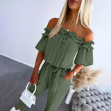 Nikola – Elegante Jumpsuit mit schulterfreien Trägern und Taillengürtel