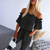 Nikola – Elegante Jumpsuit mit schulterfreien Trägern und Taillengürtel